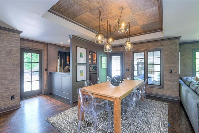 dining space featuring an inviting chandelier, wooden ceiling, dark wood finished floors, and a raised ceiling