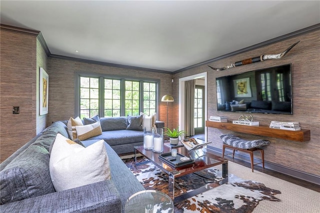 living area featuring crown molding and wood finished floors