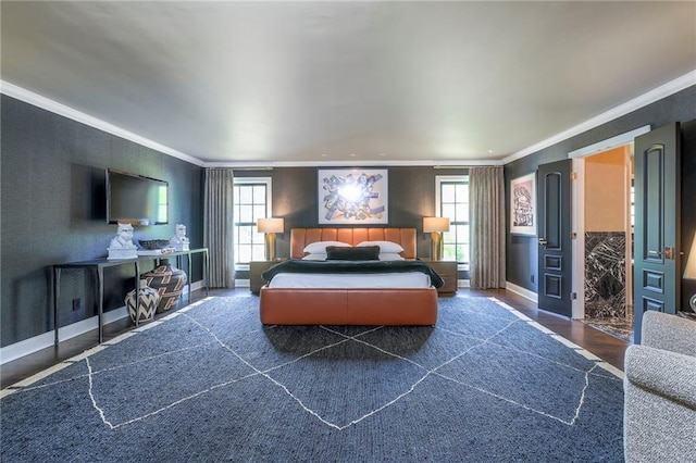 bedroom with baseboards, ornamental molding, and wood finished floors