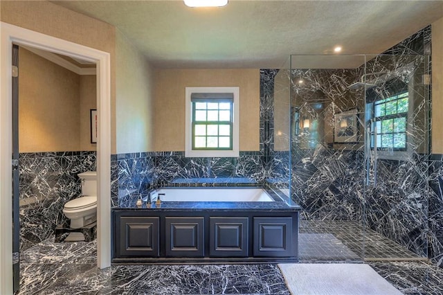 full bath featuring toilet, a marble finish shower, marble finish floor, tile walls, and a bath