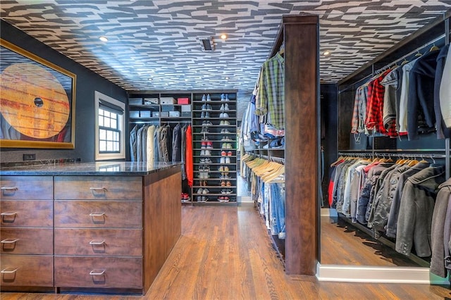 walk in closet featuring wood finished floors