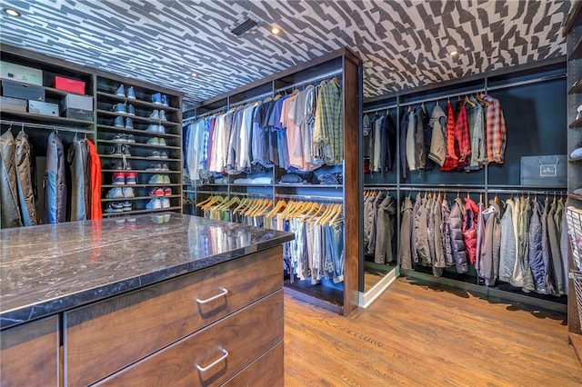 spacious closet featuring wood finished floors