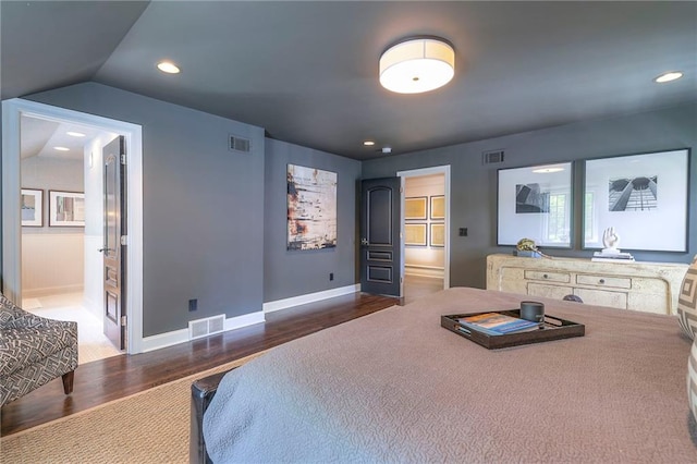 bedroom with recessed lighting, baseboards, visible vents, and wood finished floors