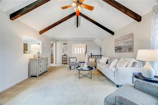 living room featuring visible vents, baseboards, a ceiling fan, vaulted ceiling with beams, and light carpet