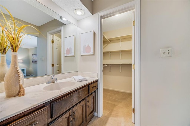 bathroom with baseboards and vanity