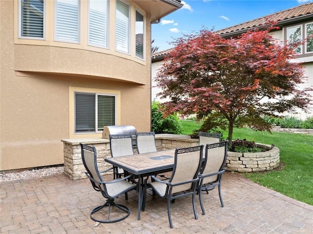 view of patio featuring outdoor dining space