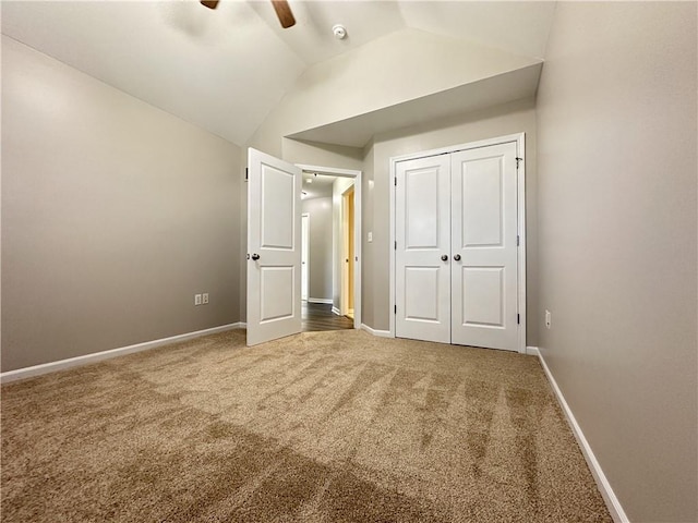 109 Deerfield Dr, Warrensburg, MO 64093 - unfurnished bedroom featuring a closet, a ceiling fan, vaulted ceiling, carpet floors, and baseboards