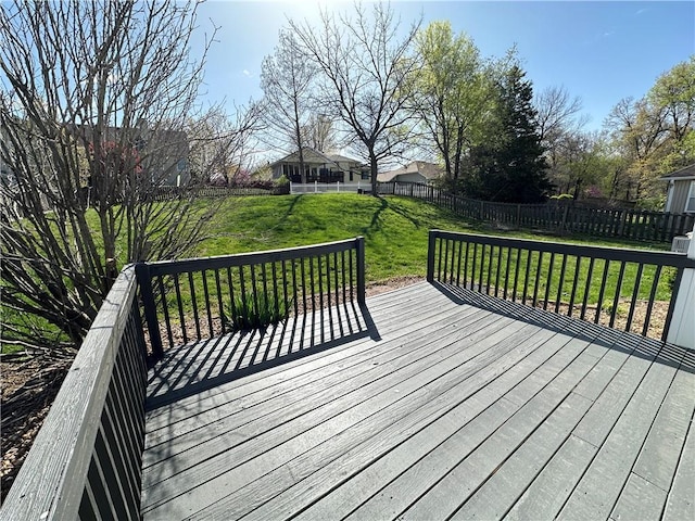 109 Deerfield Dr, Warrensburg, MO 64093 - wooden deck featuring a fenced backyard and a lawn