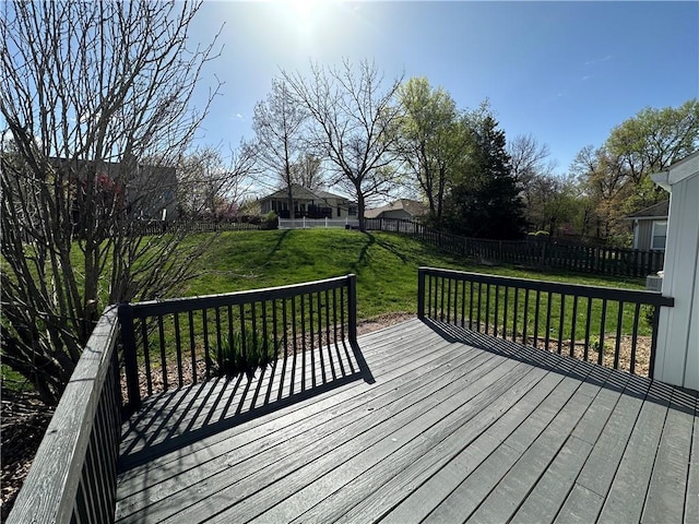 109 Deerfield Dr, Warrensburg, MO 64093 - wooden deck featuring a fenced backyard and a lawn