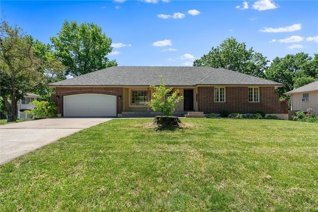 single story home featuring a garage, driveway, a front lawn, and brick siding