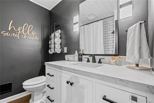 bathroom featuring toilet, vanity, wood finished floors, and a shower with shower curtain