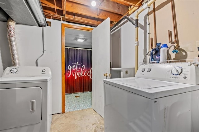 washroom with washing machine and dryer
