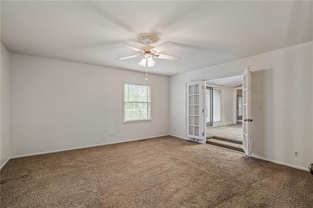 12500 Overbrook Rd, Leawood, KS 66209 - carpeted empty room with ceiling fan, a textured ceiling, and baseboards