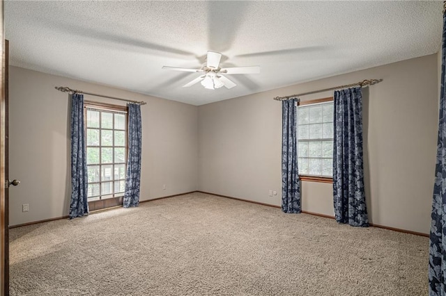 12500 Overbrook Rd, Leawood, KS 66209 - empty room with ceiling fan, carpet floors, a textured ceiling, and baseboards