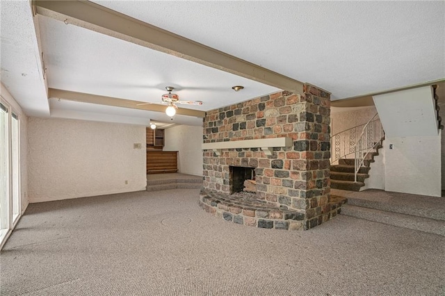 12500 Overbrook Rd, Leawood, KS 66209 - unfurnished living room with stairs, carpet flooring, a fireplace, and ceiling fan