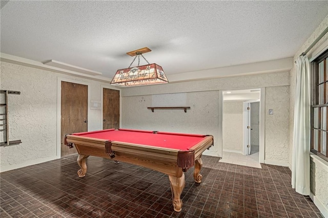 12500 Overbrook Rd, Leawood, KS 66209 - game room with a textured wall, a textured ceiling, billiards, brick patterned floors, and baseboards
