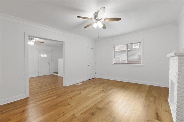 805 N 18th St, Kansas City, KS 66102 - unfurnished living room with a ceiling fan, ornamental molding, light wood finished floors, and baseboards