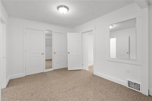 805 N 18th St, Kansas City, KS 66102 - unfurnished bedroom with a textured ceiling, carpet, and baseboards