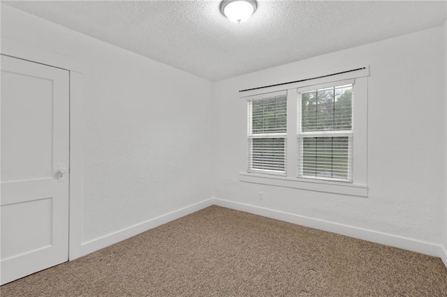 805 N 18th St, Kansas City, KS 66102 - carpeted empty room featuring a textured ceiling and baseboards