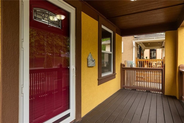 805 N 18th St, Kansas City, KS 66102 - view of exterior entry featuring stucco siding and a balcony