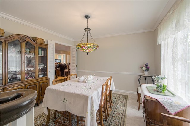 13605 W 48th St, Shawnee, KS 66216 - dining area featuring light carpet, crown molding, and baseboards