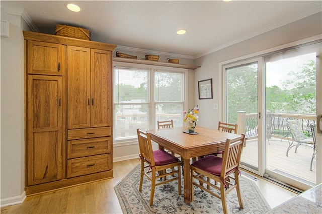 13605 W 48th St, Shawnee, KS 66216 - dining room with plenty of natural light, light wood finished floors, ornamental molding, recessed lighting, and baseboards