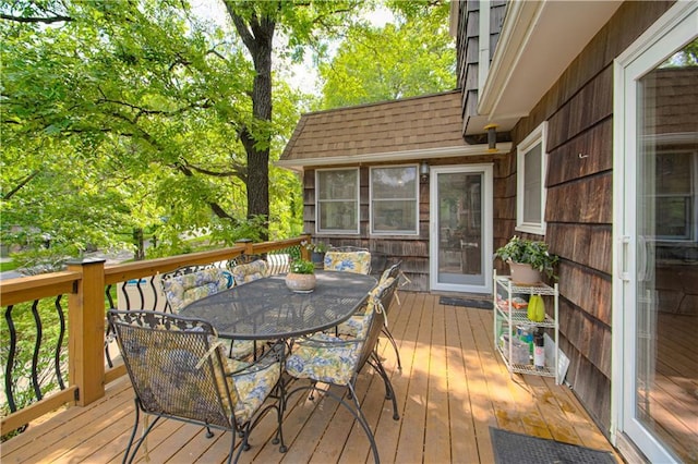 13605 W 48th St, Shawnee, KS 66216 - wooden terrace with outdoor dining area