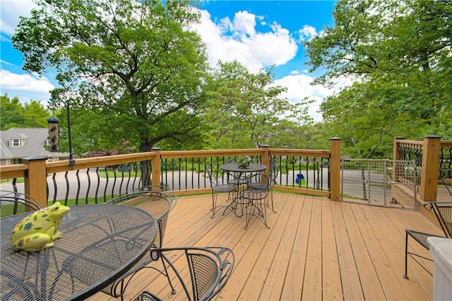 13605 W 48th St, Shawnee, KS 66216 - wooden terrace featuring outdoor dining area