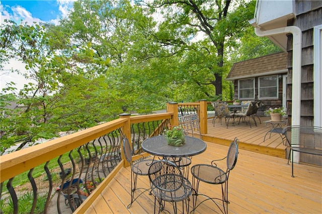 13605 W 48th St, Shawnee, KS 66216 - wooden terrace featuring outdoor dining area