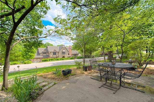 13605 W 48th St, Shawnee, KS 66216 - view of patio / terrace featuring outdoor dining area