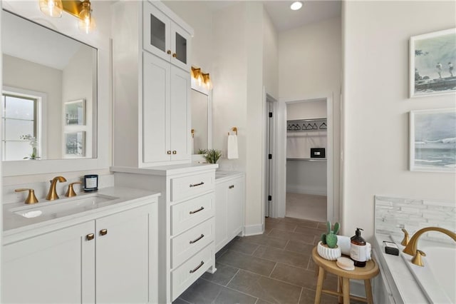8016 Round Prairie St, Shawnee, KS 66220 - full bathroom featuring recessed lighting, tile patterned flooring, a bath, vanity, and a spacious closet
