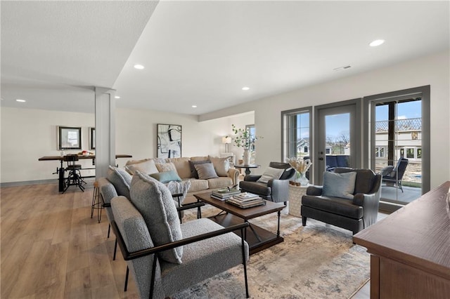 8016 Round Prairie St, Shawnee, KS 66220 - living area with light wood-style floors, recessed lighting, and baseboards