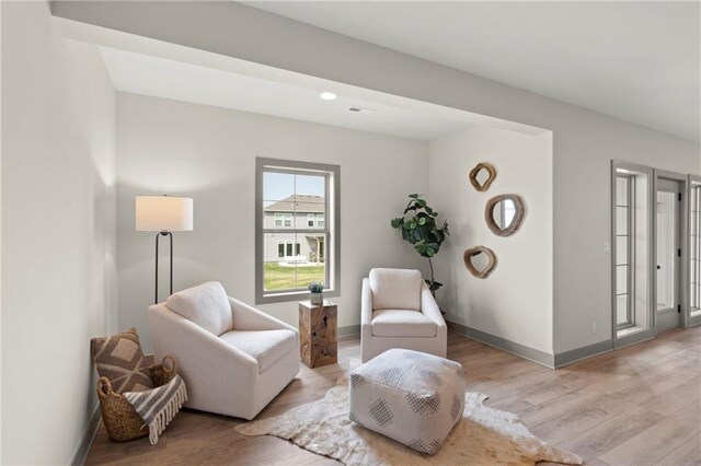 8016 Round Prairie St, Shawnee, KS 66220 - living area featuring wood finished floors and baseboards