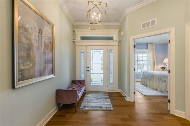 420 NW Kaylea Ct, Lees Summit, MO 64081 - entrance foyer featuring hardwood / wood-style flooring, ornamental molding, and a chandelier