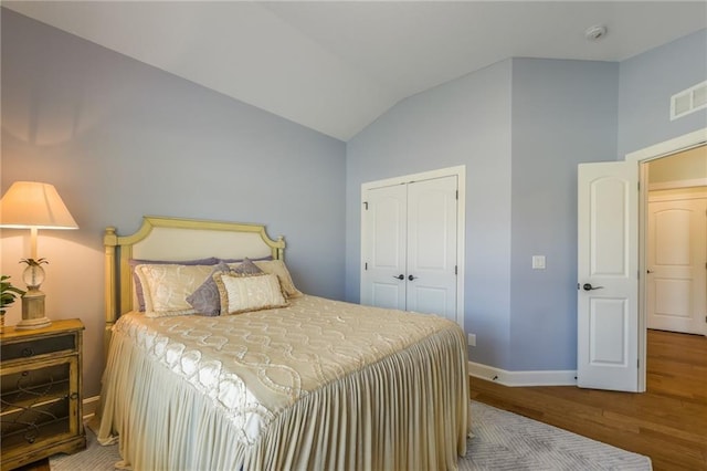 420 NW Kaylea Ct, Lees Summit, MO 64081 - bedroom with wood finished floors, lofted ceiling, and a closet
