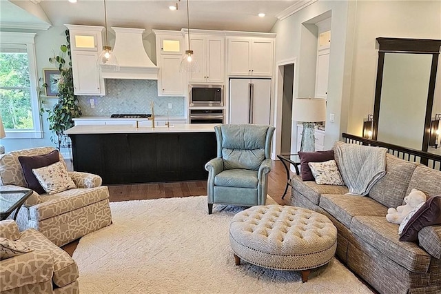 420 NW Kaylea Ct, Lees Summit, MO 64081 - living room featuring wood finished floors, crown molding, and recessed lighting