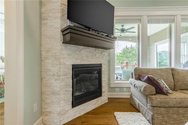 420 NW Kaylea Ct, Lees Summit, MO 64081 - living room with wood finished floors, a fireplace, and a ceiling fan