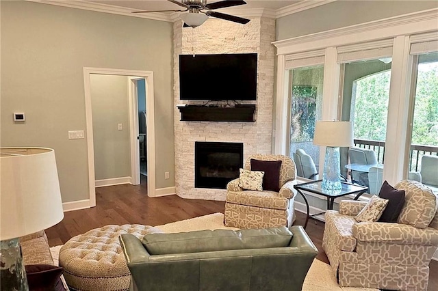 420 NW Kaylea Ct, Lees Summit, MO 64081 - living room with ceiling fan, ornamental molding, dark wood-type flooring, a fireplace, and healthy amount of natural light