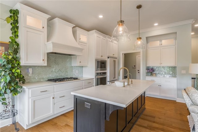 420 NW Kaylea Ct, Lees Summit, MO 64081 - kitchen with custom range hood, appliances with stainless steel finishes, decorative backsplash, light countertops, and recessed lighting