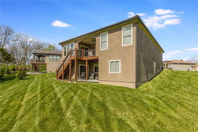 420 NW Kaylea Ct, Lees Summit, MO 64081 - back of house featuring ceiling fan, stairway, a lawn, and a wooden deck