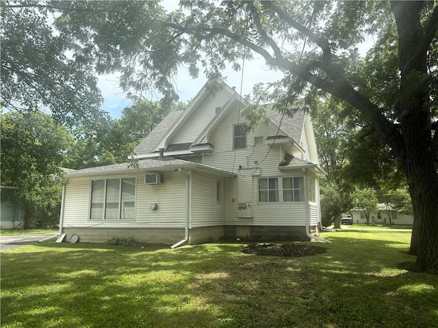 214 W 5th St, Lebo, KS 66856 - back of house with a lawn and a shingled roof