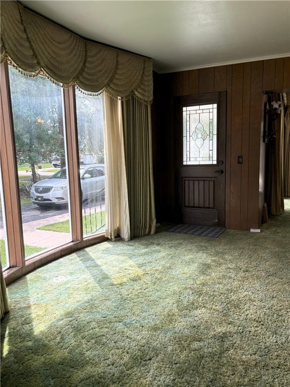 214 W 5th St, Lebo, KS 66856 - unfurnished living room with carpet floors and wood walls