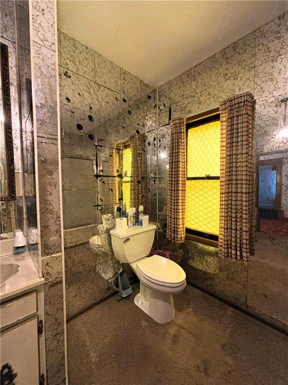 214 W 5th St, Lebo, KS 66856 - bathroom featuring vanity and toilet