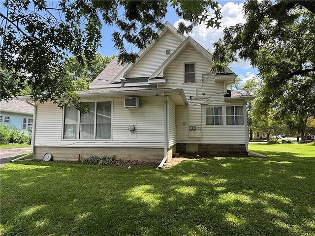 214 W 5th St, Lebo, KS 66856 - rear view of house with a yard and roof with shingles