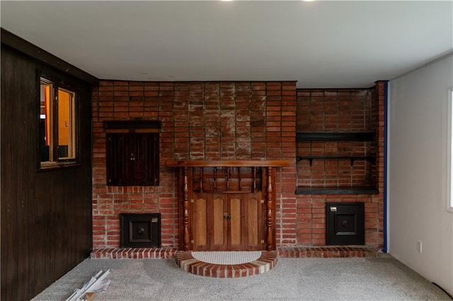 717 Y St, Atchison, KS 66002 - unfurnished living room with a fireplace and carpet flooring