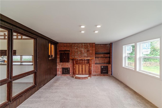 717 Y St, Atchison, KS 66002 - unfurnished living room featuring a fireplace and carpet