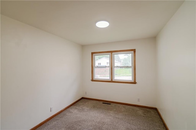 717 Y St, Atchison, KS 66002 - carpeted empty room featuring baseboards