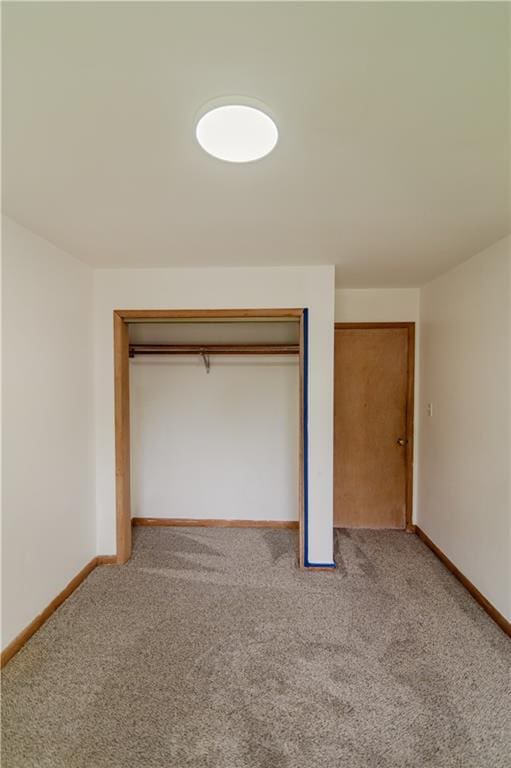 717 Y St, Atchison, KS 66002 - unfurnished bedroom with carpet floors, baseboards, and a closet