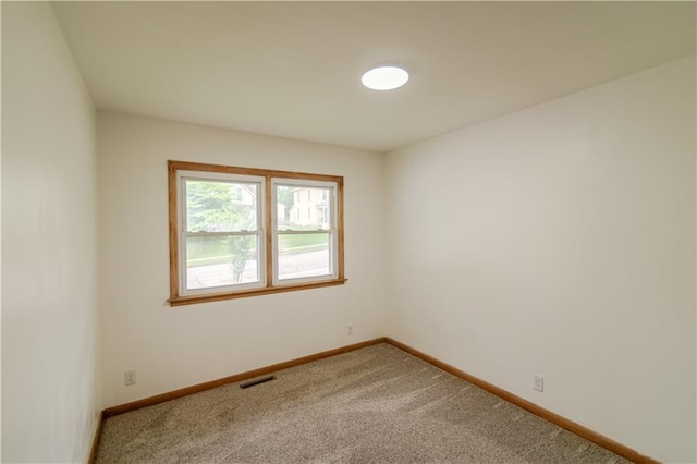 717 Y St, Atchison, KS 66002 - carpeted spare room featuring baseboards