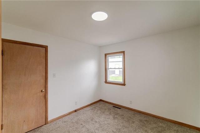 717 Y St, Atchison, KS 66002 - carpeted empty room featuring baseboards